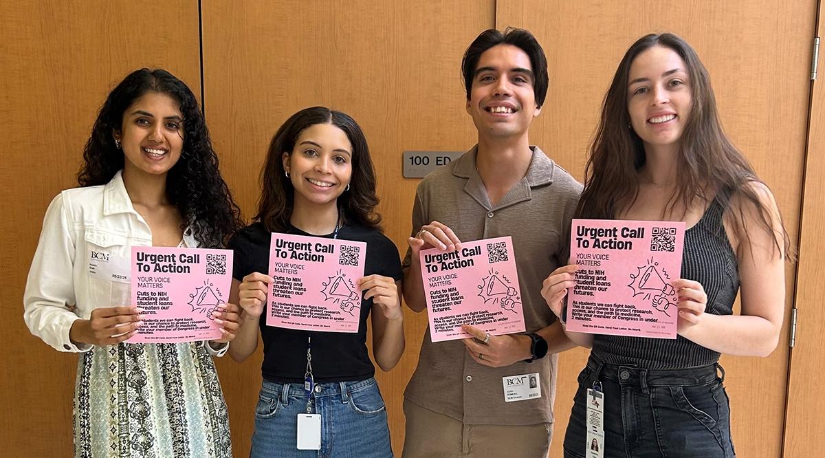 Anokhi Shah, Shae-Marie Stafford Trujillo, Juan Romero, and Samantha Tilley, all students at Baylor College of Medicine, pose with flyers to encourage their fellow students to send letters to Congress about student loans and National Institutes of Health funding.