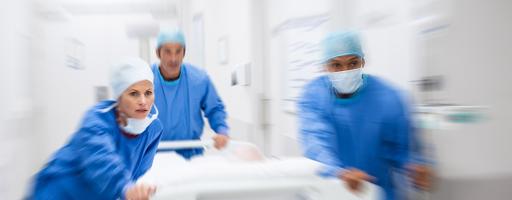 doctors rushing stretcher down hallway