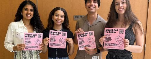 Anokhi Shah, Shae-Marie Stafford Trujillo, Juan Romero, and Samantha Tilley, all students at Baylor College of Medicine, pose with flyers to encourage their fellow students to send letters to Congress about student loans and National Institutes of Health funding.