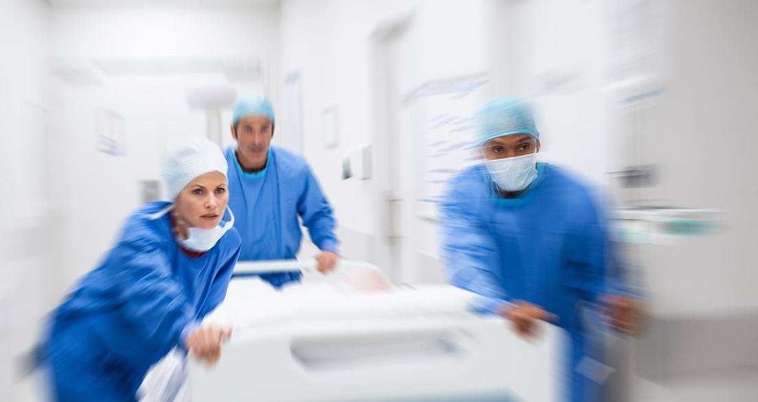 doctors rushing stretcher down hallway