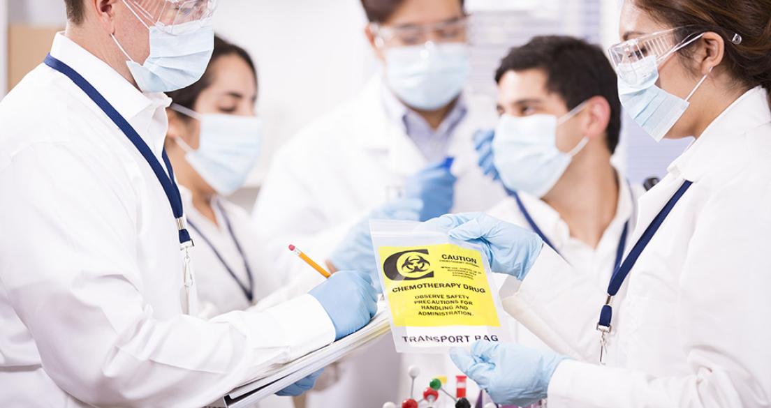 scientists with chemotherapy drug